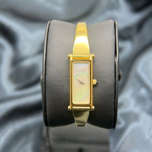 Gucci Vintage Golden Pearl Face Bangle Watch
Model Number: 1500L
Swiss Made