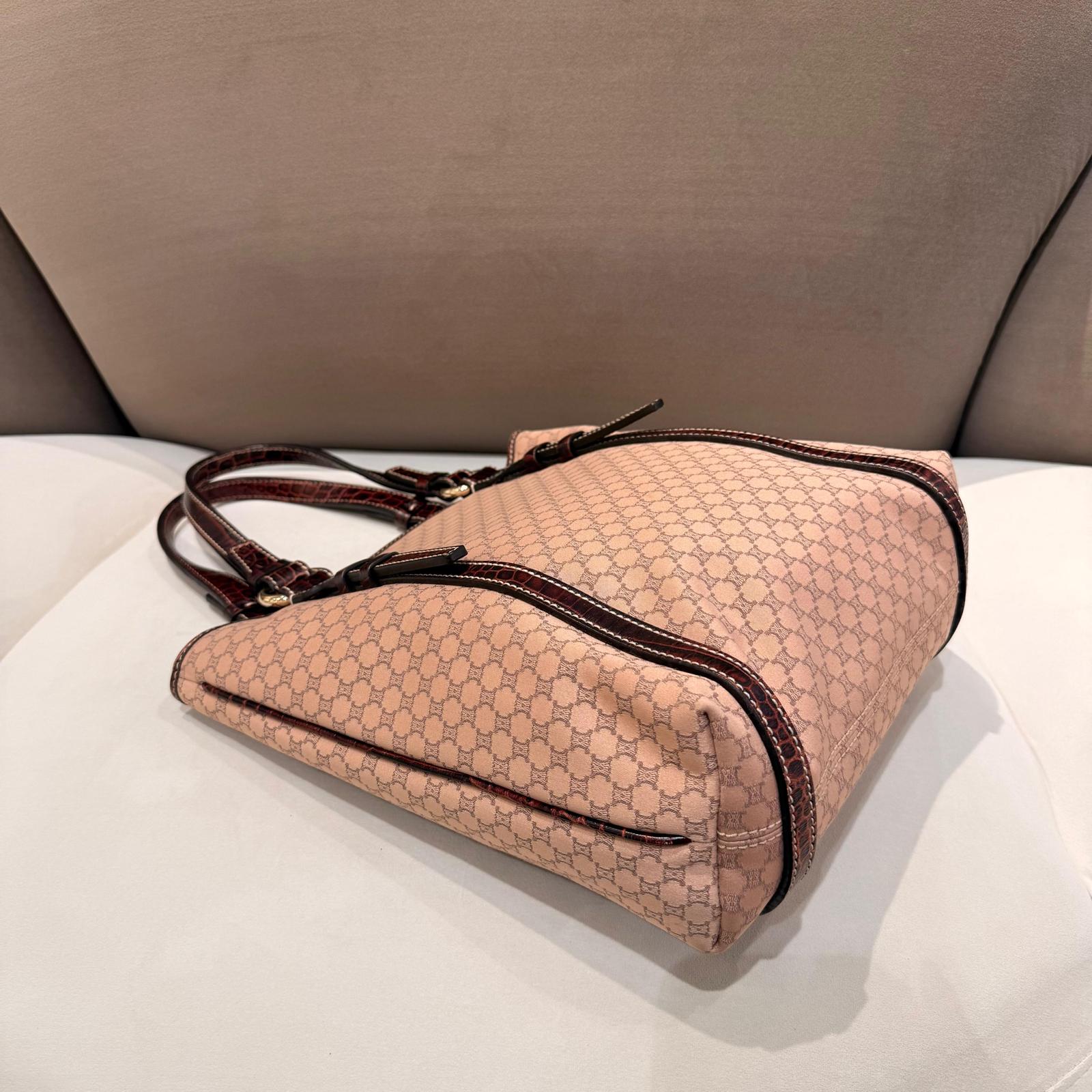 CELINE vintage dusty pink monogram tote bag laid flat, showing side and base