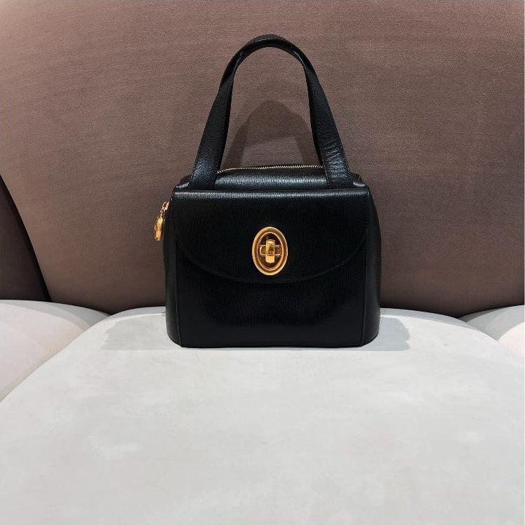 Christian Dior Vintage black leather oval turn-lock handbag – front view